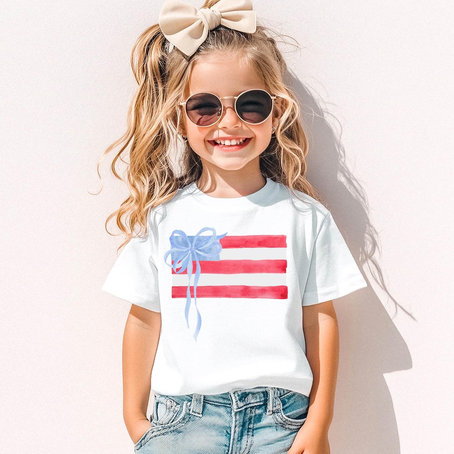 Girls Fourth July Shirt Watercolor American Flag Design Kids Patriotic Tee Blue Bow Accent Independence Day Outfit Youth Summer Celebration Wear Red White Blue Stripes Stars Pattern Comfortable Cotton Fabric Memorial Day Clothing Toddler