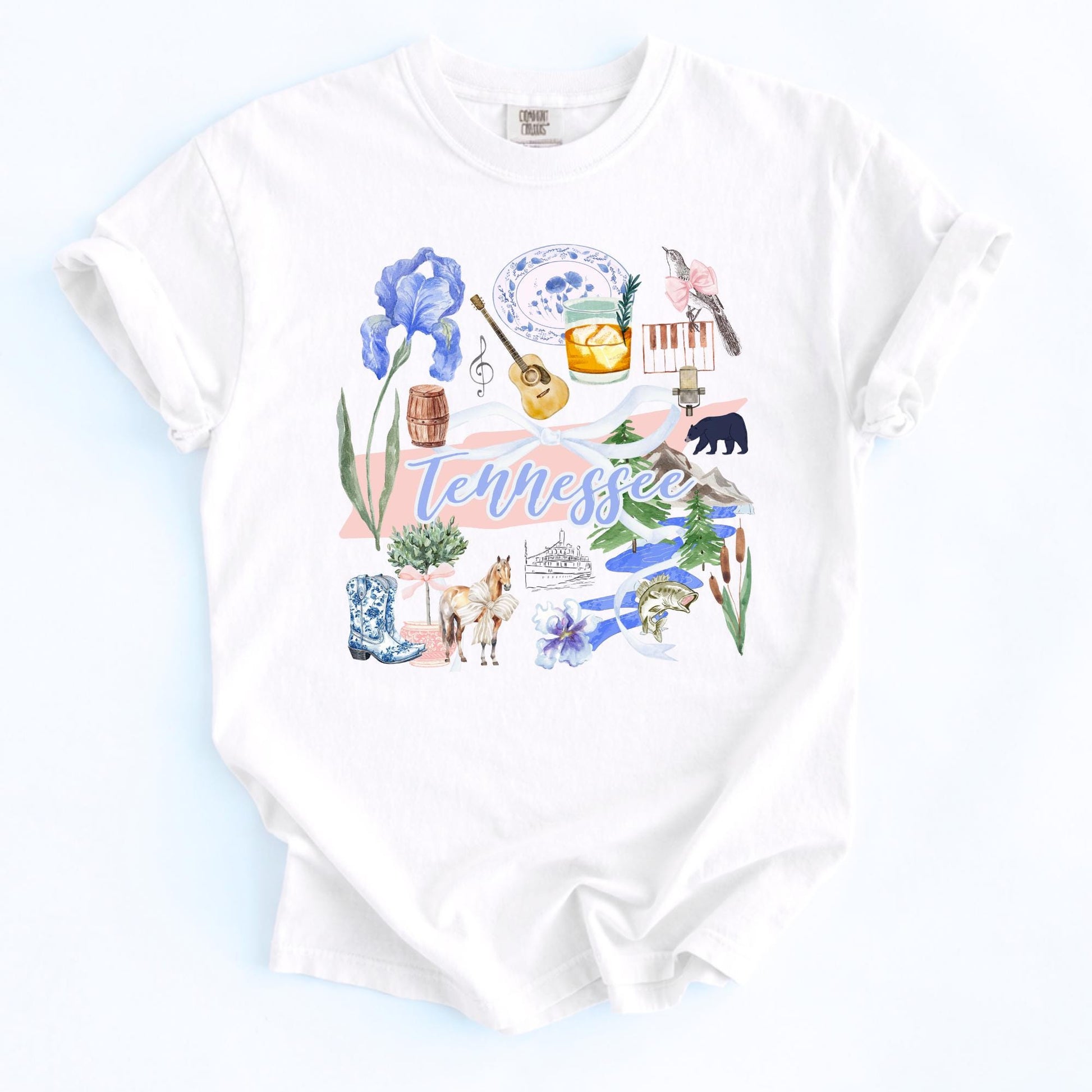 Nashville Shirt Women Music City Souvenir Tennessee Graphic Tee Volunteer State Pride Apparel Vintage Style Design Blue Iris Flowers Black Bear Cowboy Boots Banjo Symbols Cream Colored Casual Wear Perfect For Country Concerts Festival
