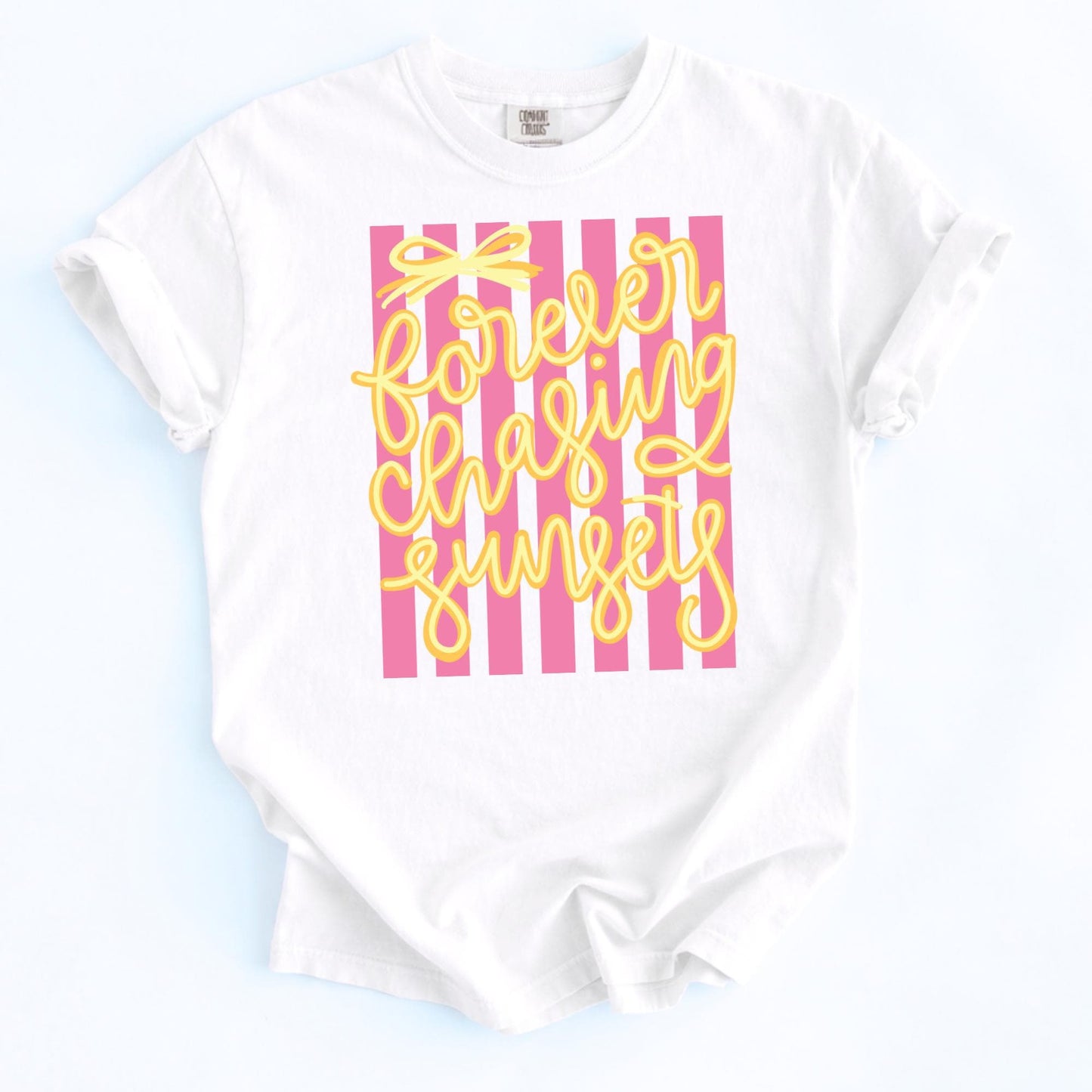 Forever Chasing Sunsets Shirt Retro Beach Tee Vintage Graphic Design Seventies Summer Fashion Pink White Striped Pattern Yellow Script Lettering Coastal Vacation Shirt Comfort Colors Fabric Soft Cotton Blend Relaxed Casual Fit Beach