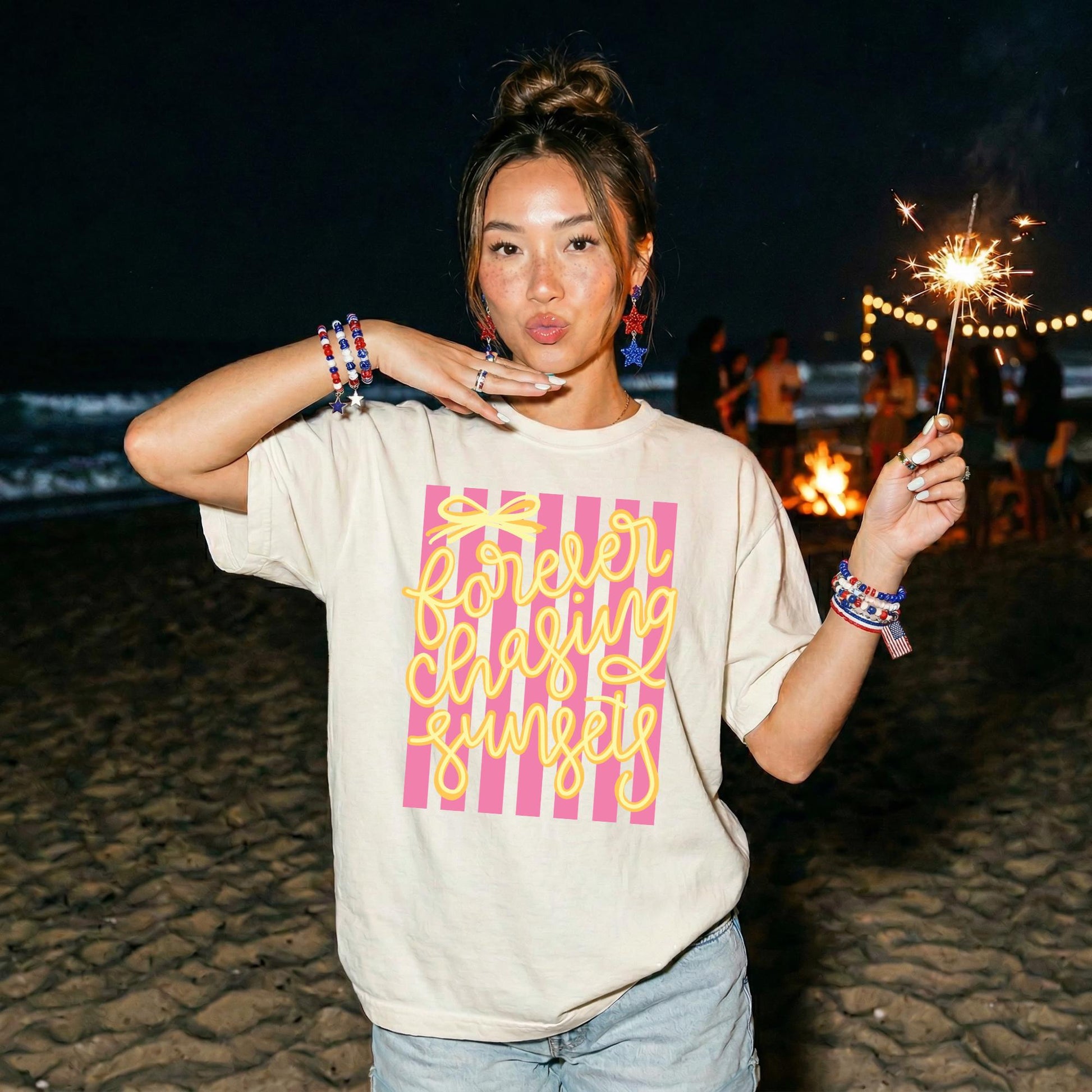 Beach Vacation Graphic Shirt Retro Sunset Tee Vintage Summer Apparel Seventies Striped Design Yellow Cursive Forever Chasing Sunsets Text Pink White Stripe Pattern Coastal Lifestyle Shirt Comfort Colors Cotton Soft Relaxed Fit Casual Beach