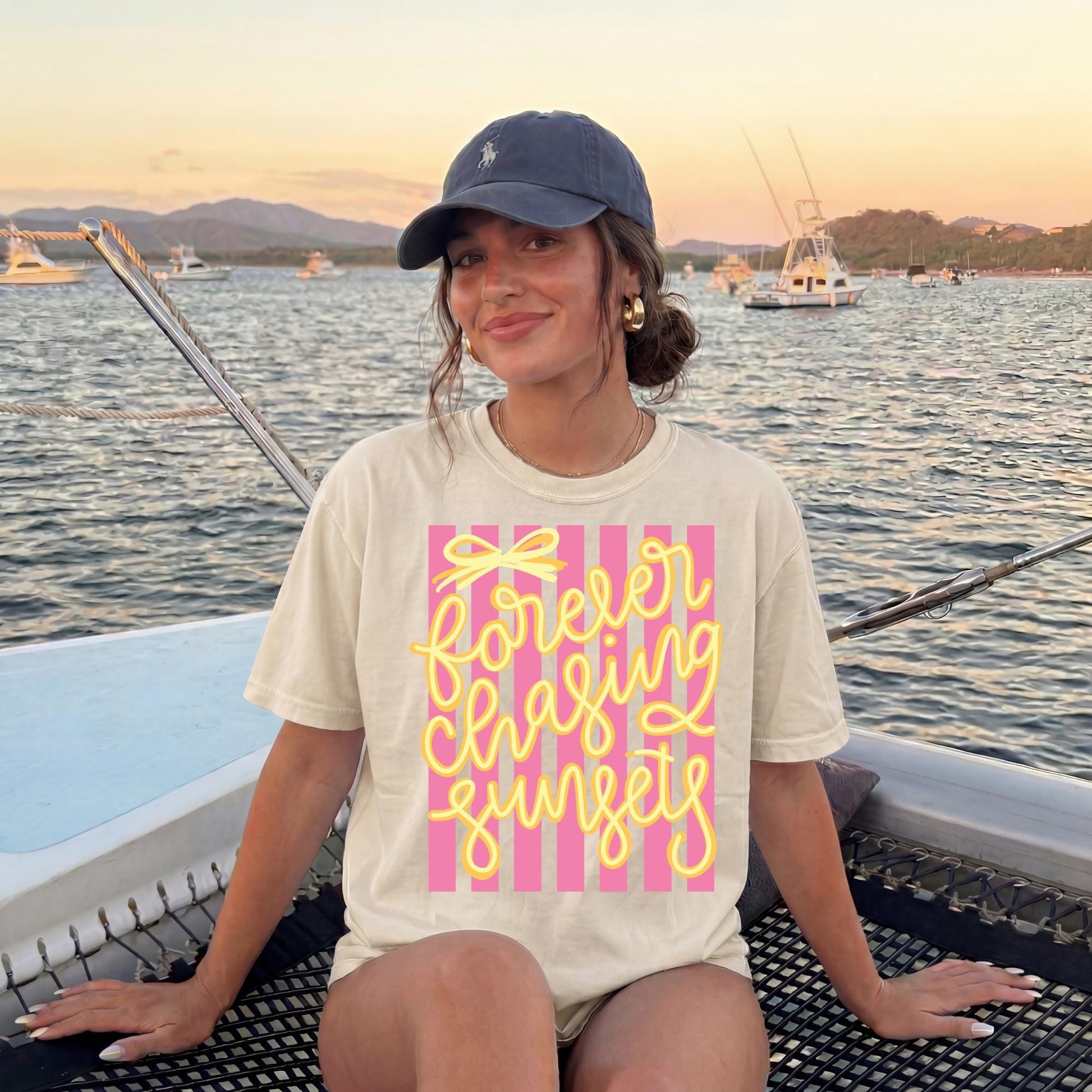 Retro Beach Vacation Tee Vintage Sunset Graphic Shirt Seventies Striped Design Forever Chasing Sunsets Text Yellow Script Lettering Pink Stripe Pattern Coastal Vibes Apparel Summer Travel Shirt Comfort Colors Cotton Soft Relaxed Fit Beach