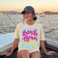 Soft Breathable Fabric Tee Women White Beach Vacation Shirt Pink Script Beach Bum Text Blue Stripe Accent Summer Casual Wear Comfortable Resort Outfit Tropical Trip Clothing Cruise Apparel Essential Poolside Casual Top Relaxed Fit Design