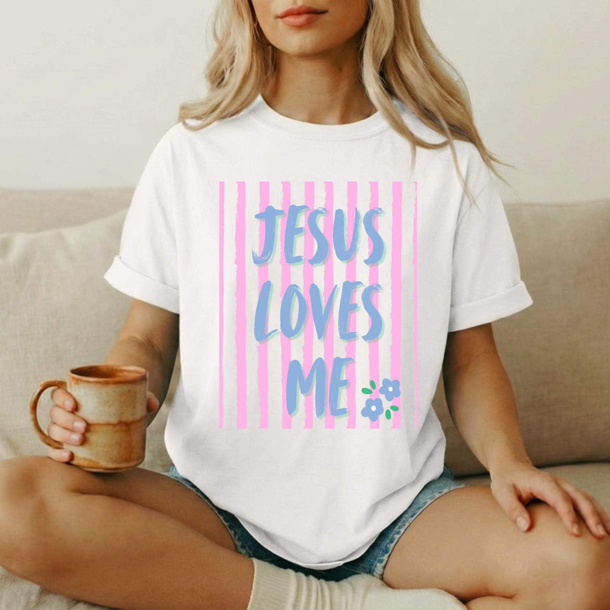 Christian Graphic Tee Women Jesus Loves Me Shirt Faith Based Religious Apparel Inspirational Scripture Message Design Gradient Blue Purple Typography Pink Vertical Stripe Pattern Floral Detail Accent Premium Cotton Fabric Comfort Church