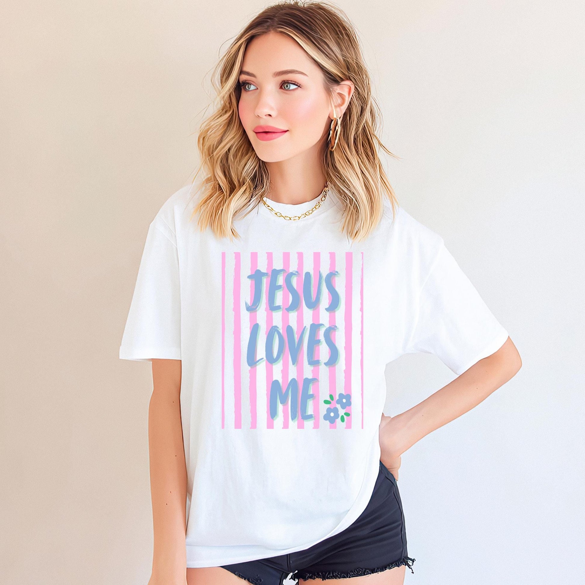 Jesus Loves Me Shirt Christian Graphic Tee Women Faith Based Apparel Religious Clothing Top Inspirational Message Scripture Design Gradient Blue Purple Text Pink Stripe Pattern Floral Accent Detail Premium Cotton Comfort Fabric Church