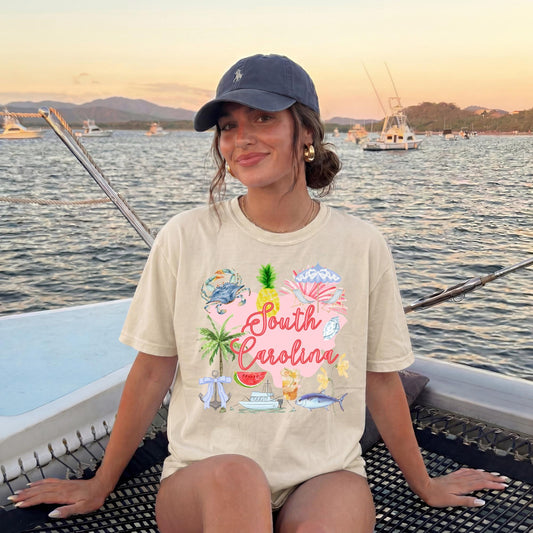 Tropical Beach Shirt South Carolina Coastal Tee Colorful Graphic Design Pink Lettering Style Pineapple Palm Tree Watermelon Crab Seashell Artwork Vacation Souvenir Apparel Summer Travel Outfit Casual Comfortable Wear Tourist Gift Item