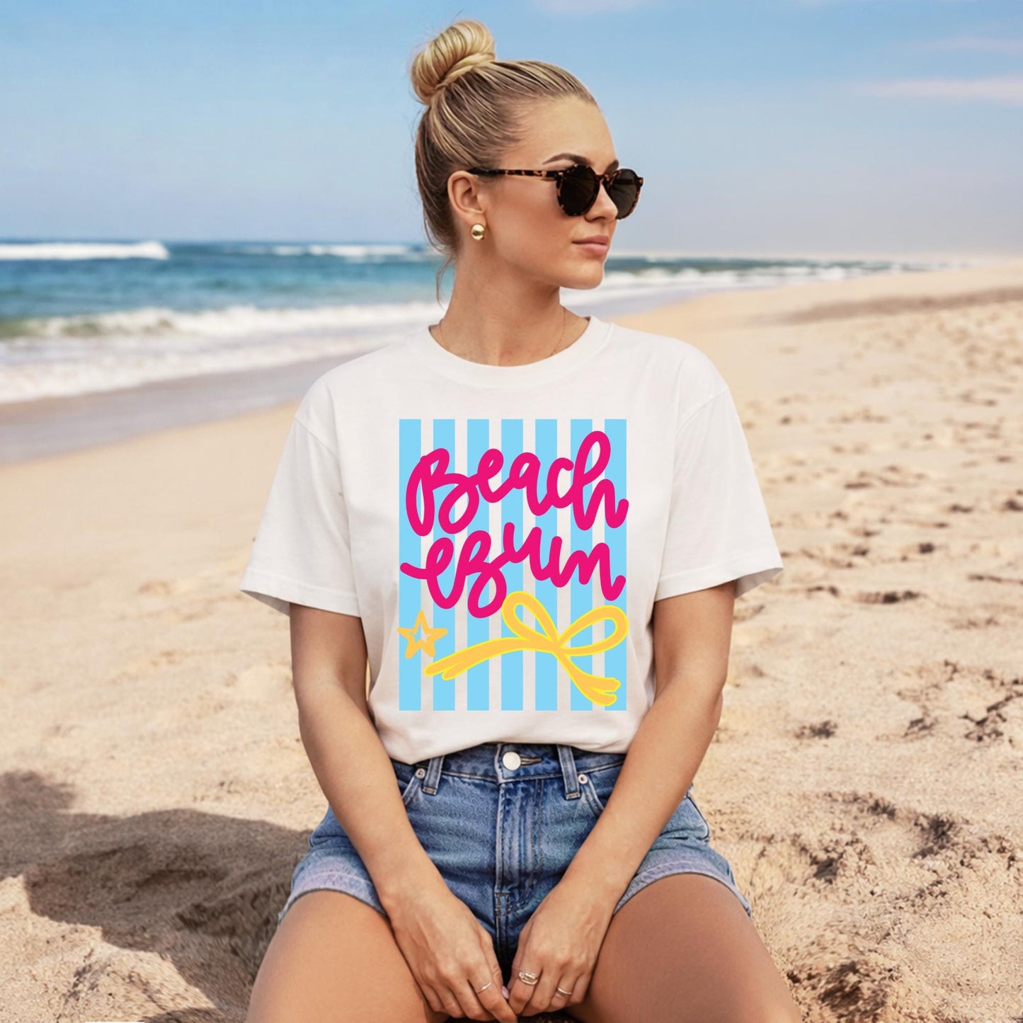 White Graphic Tee Women Pink Script Lettering Beach Bum Design Blue Striped Pattern Yellow Bow Detail Summer Vacation Shirt Casual Resort Wear Tropical Travel Top Cruise Outfit Essential Poolside Casual Clothing Soft Cotton Blend Relaxed