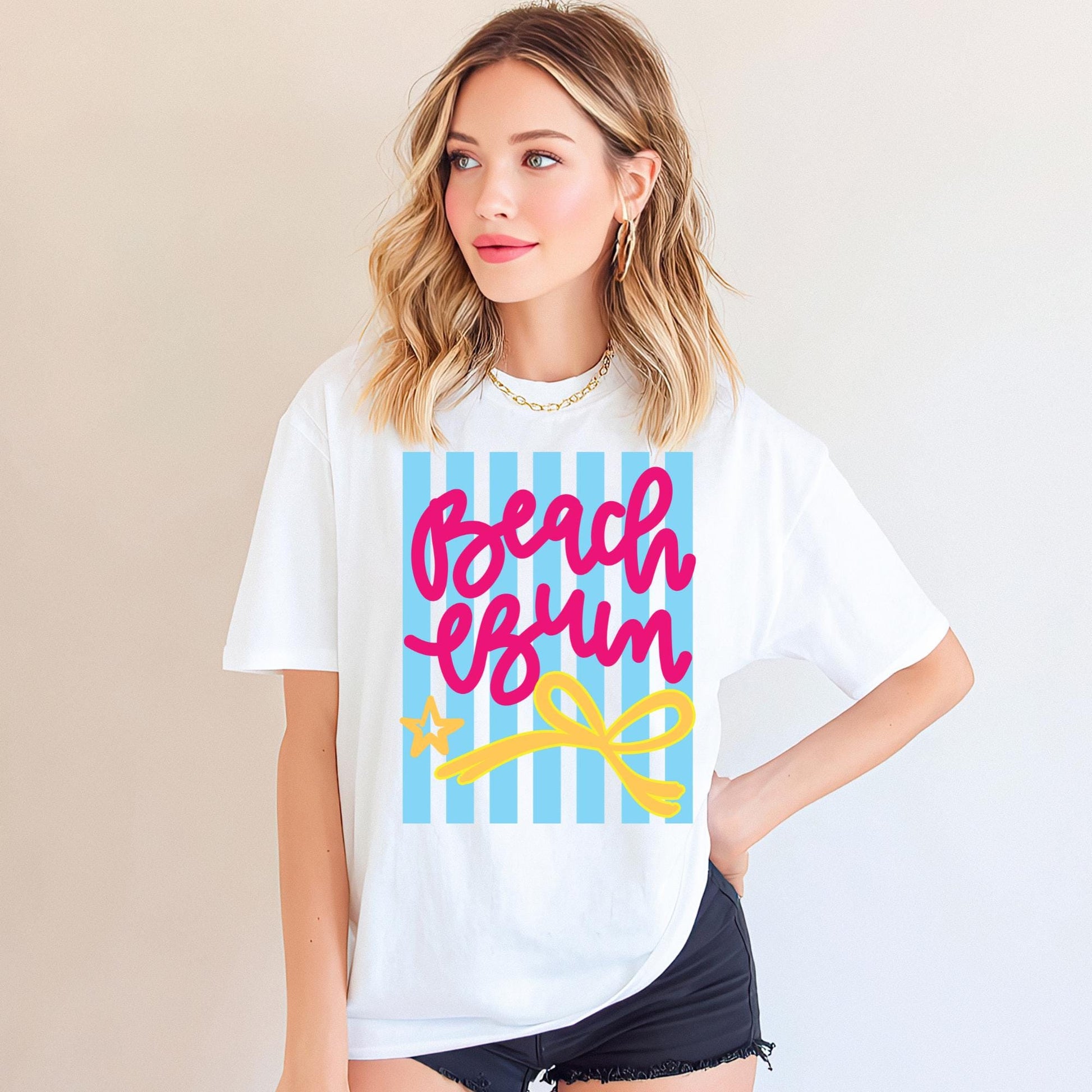 Beach Bum Graphic Shirt Women White Casual Tee Pink Script Lettering Design Blue Striped Beach Pattern Summer Coastal Wear Tropical Vacation Outfit Resort Casual Clothing Cruise Travel Essential Poolside Loungewear Soft Comfortable Fabric