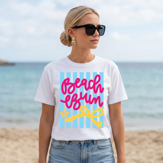 Beach Vacation Shirt Women White Graphic Tee Summer Resort Wear Pink Script Beach Bum Lettering Blue Striped Design Yellow Bow Accent Casual Outfit Tropical Travel Clothing Cruise Apparel Poolside Outfit Coastal Trip Essential Soft